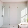 Stylish installation of sunney shower doors in a modern bathroom with bright decor.