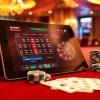 SboBet offers thrilling online betting with chips and cards at a luxe casino table.