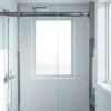 Stylish shower screen door reflecting modern design in a bright bathroom.