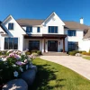 Showcase of a Sharon Custom Colonial New Build with elegant design and beautiful landscaping.