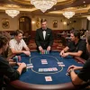 Engaged players compete at a high-stakes poker table in nhà cái 388bet, showcasing strategy and excitement.
