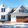 Bright Cape Cod home addition with a sleek attached garage reflecting coastal elegance.