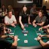 Players engaged in a thrilling poker game at 99win, showcasing vibrant chips and cards.