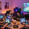 Gamers immersed in adult games on diverse devices in a vibrant game room setting.